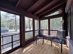 A wonderful screen porch welcoming you in to cabin 3
